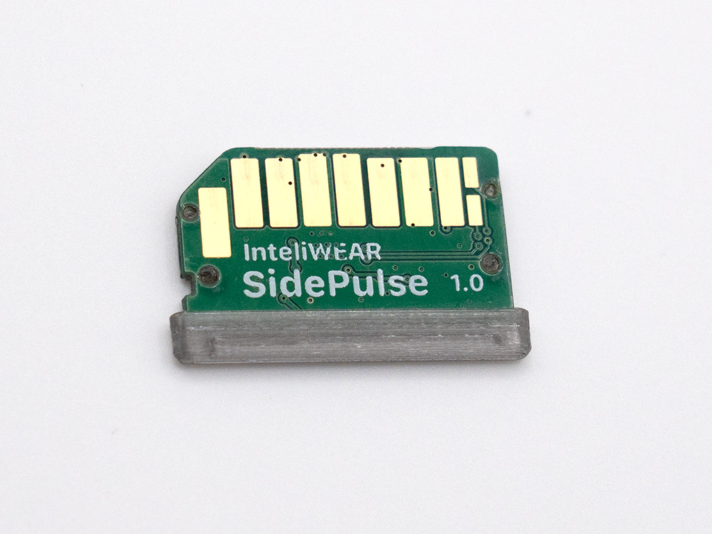 The SidePulse Pro card out of the slot, showing its gold contacts