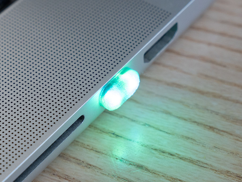 SidePulse Dot glowing green in a MacBook USB-C port